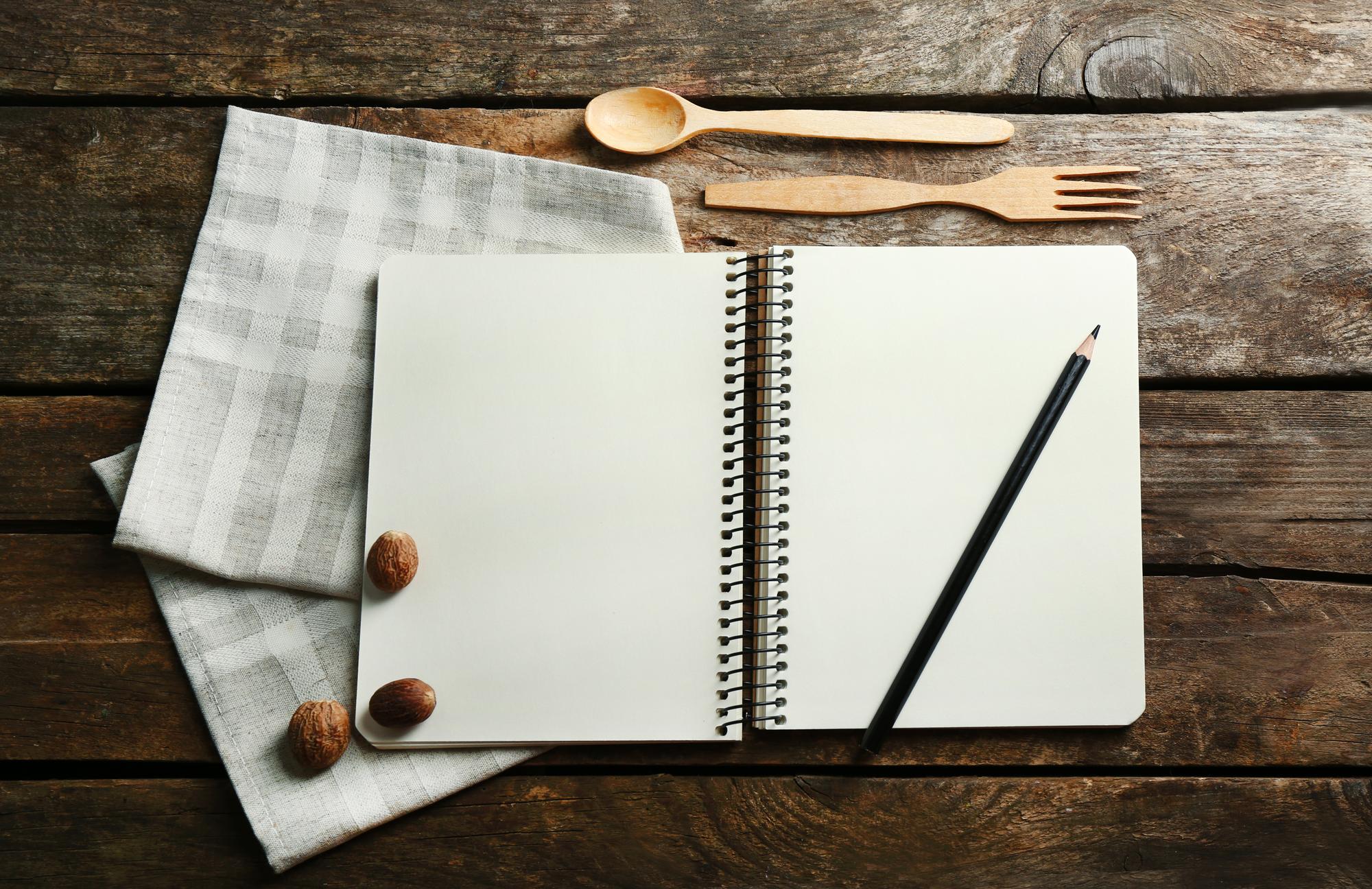 open notebook with menu planning notes
